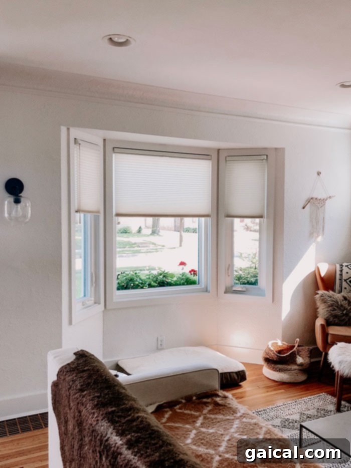 Custom Hunter Douglas Shades: Perfect Fit for Bay Windows Bay window with elegant custom Hunter Douglas Duette Honeycomb Shades, demonstrating perfect fit and style