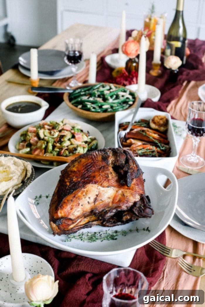 turkey on Friendsgiving table, garnished with herbs and fruit