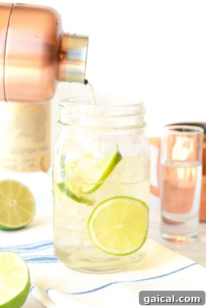 Classic Moscow Mules Three classic Moscow Mules in traditional copper mugs, garnished with lime wedges, ready for enjoyment.