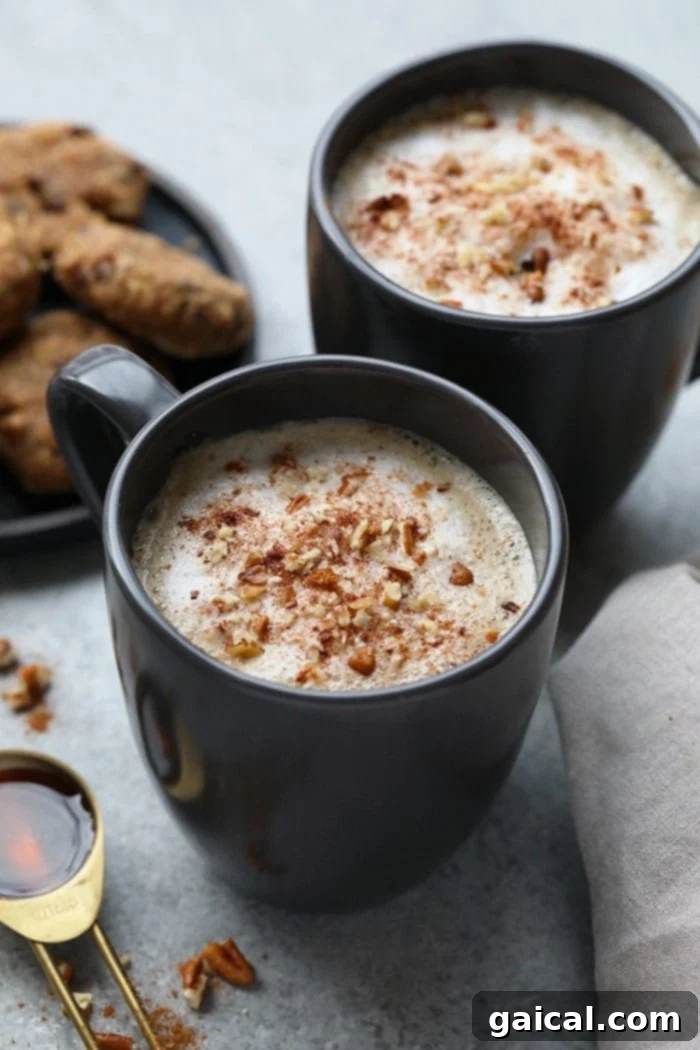 Maple Pecan Latte A homemade Maple Pecan Latte in a glass mug, topped with whipped cream and a sprinkle of pecans.