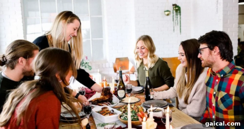 Thanksgiving Harvest Libations 2 Friends gathered around a beautifully set table, enjoying a Friendsgiving meal and drinks.