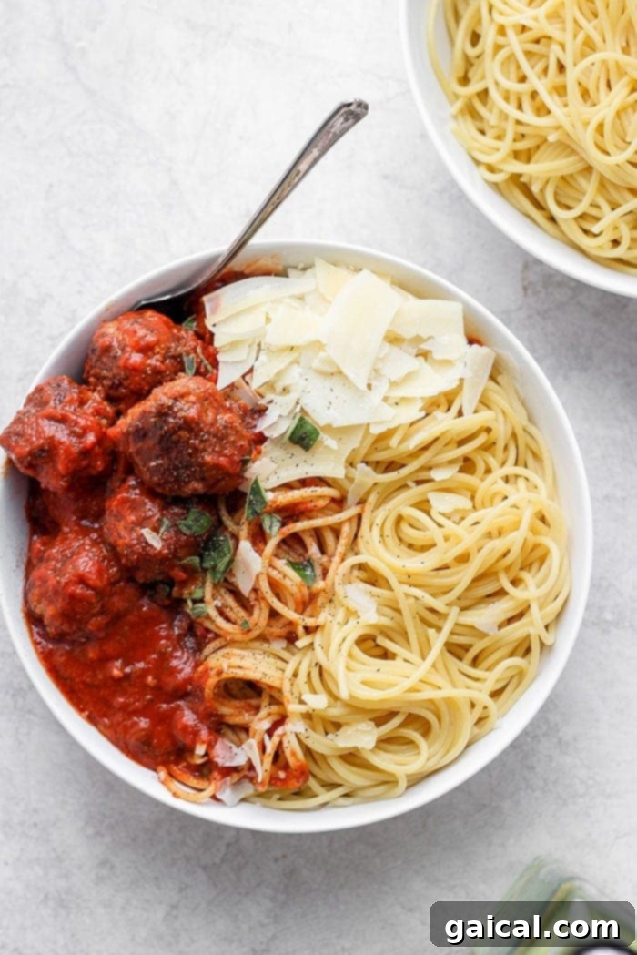 Spaghetti and meatballs on plate. 