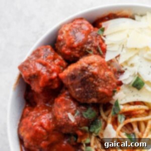 meatballs in bowl with parmesan cheese.