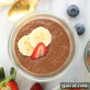Three jars of protein-packed chia seed pudding with berries and bananas as toppings