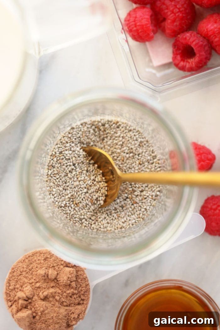 Close-up of white chia seeds in a measuring cup, ready for mixing