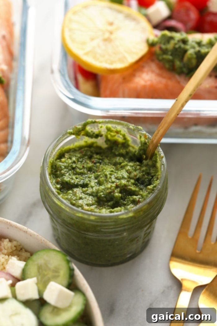Effortless Mediterranean Salmon Meals 4 Homemade arugula mint pesto in a glass jar, showing its bright green color and fresh texture, ready to enhance any dish