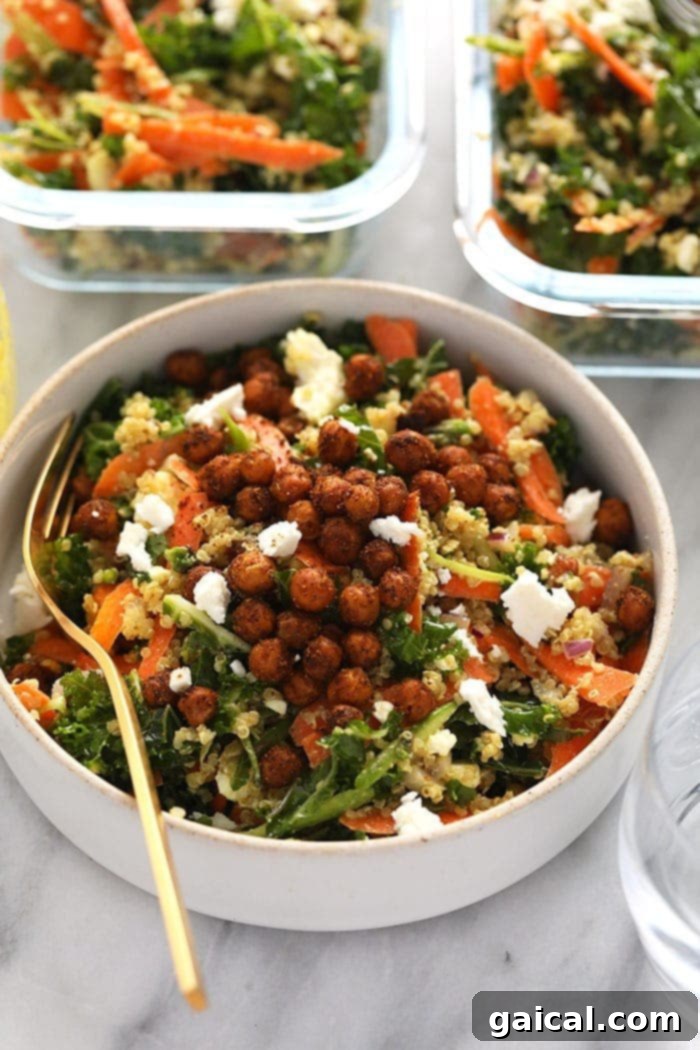 A colorful bowl of Moroccan quinoa salad garnished with fresh mint and crispy chickpeas.