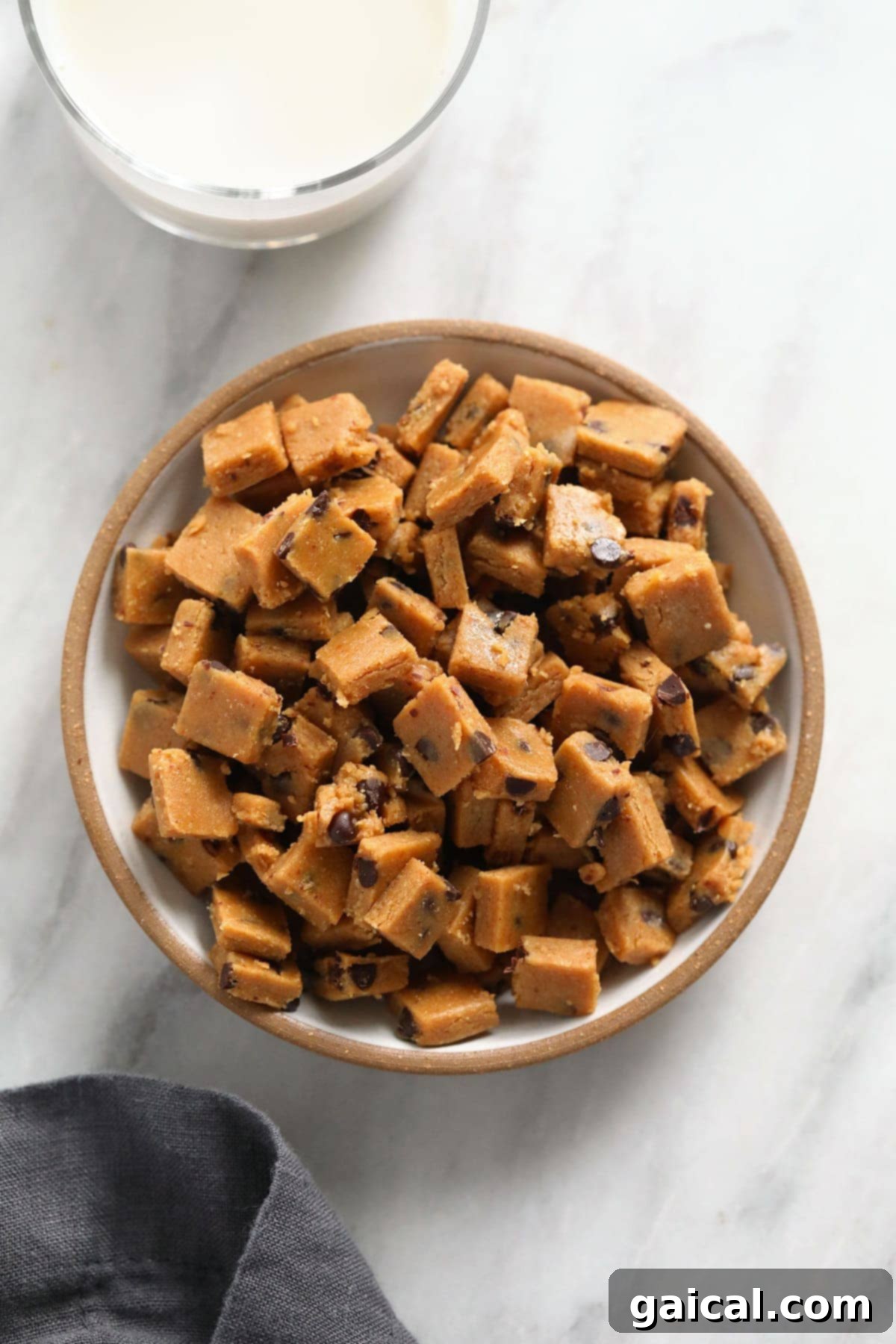Enjoy these healthy and safe vegan cookie dough bites anytime! Bowl of homemade vegan chocolate chip cookie dough bites, ready to eat.