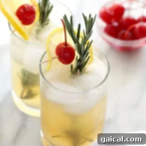 Rosemary Collins cocktail, showcasing the beautiful clear drink with rosemary and lemon garnish.