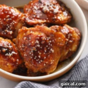 Honey garlic sesame chicken in a bowl, ready to be served.