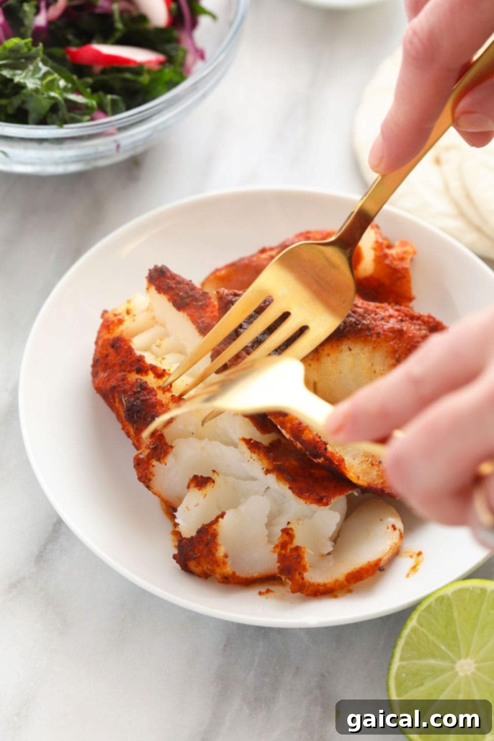 Preparing Flaky Fish for Tacos Fresh fish being expertly chunked for baked fish tacos, showcasing its flaky texture.