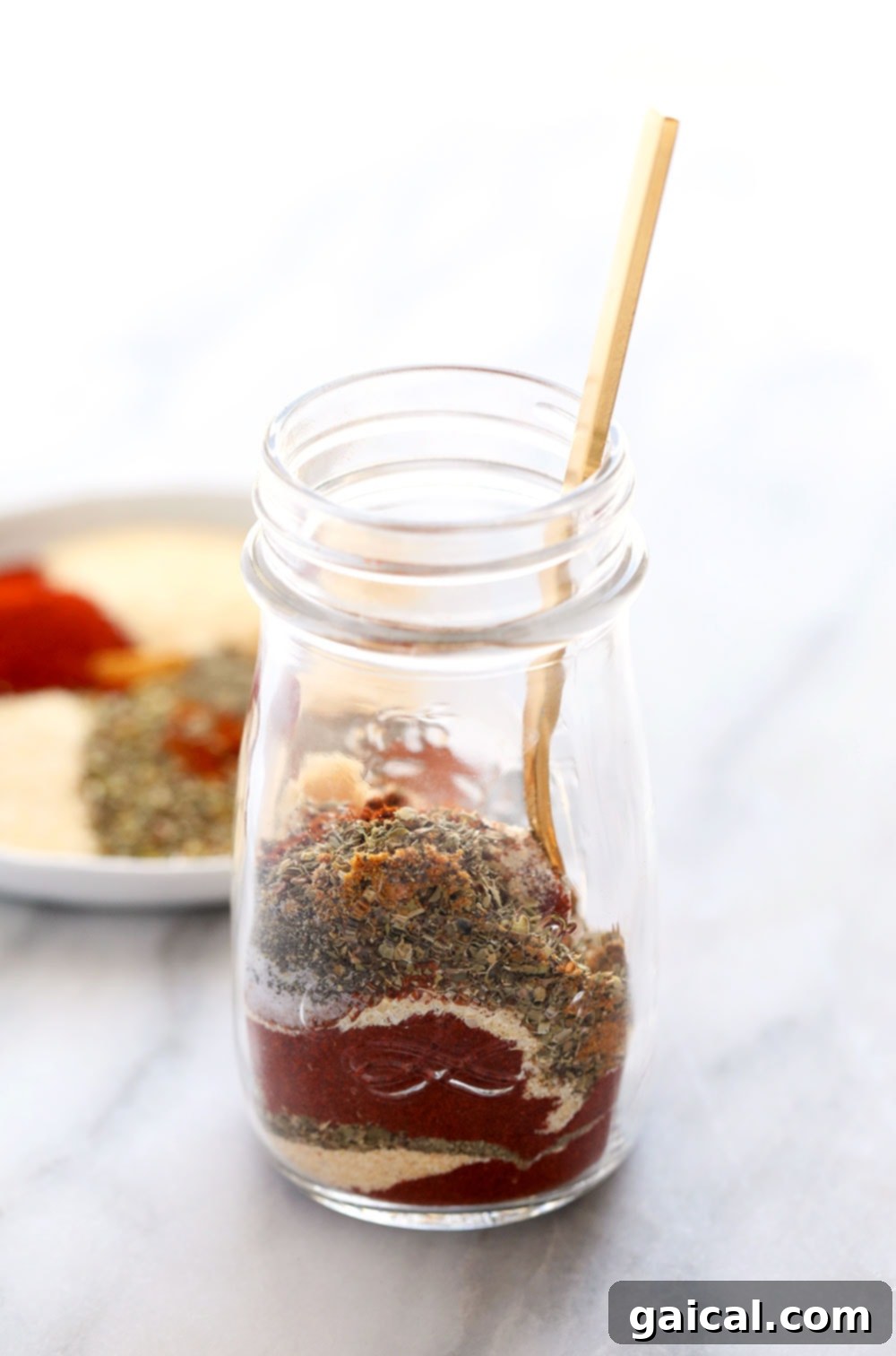 DIY Cajun Spice Blend 2 Homemade Cajun seasoning in a spice jar, ready to be used