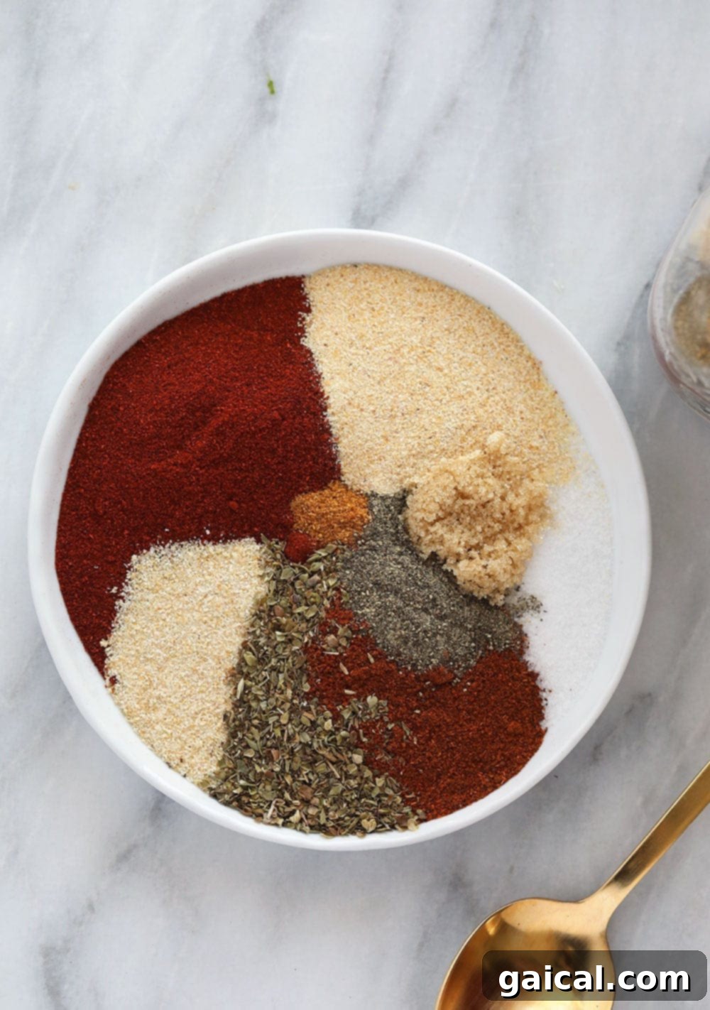 DIY Cajun Spice Blend 3 Homemade Cajun seasoning on a plate, showcasing its vibrant color