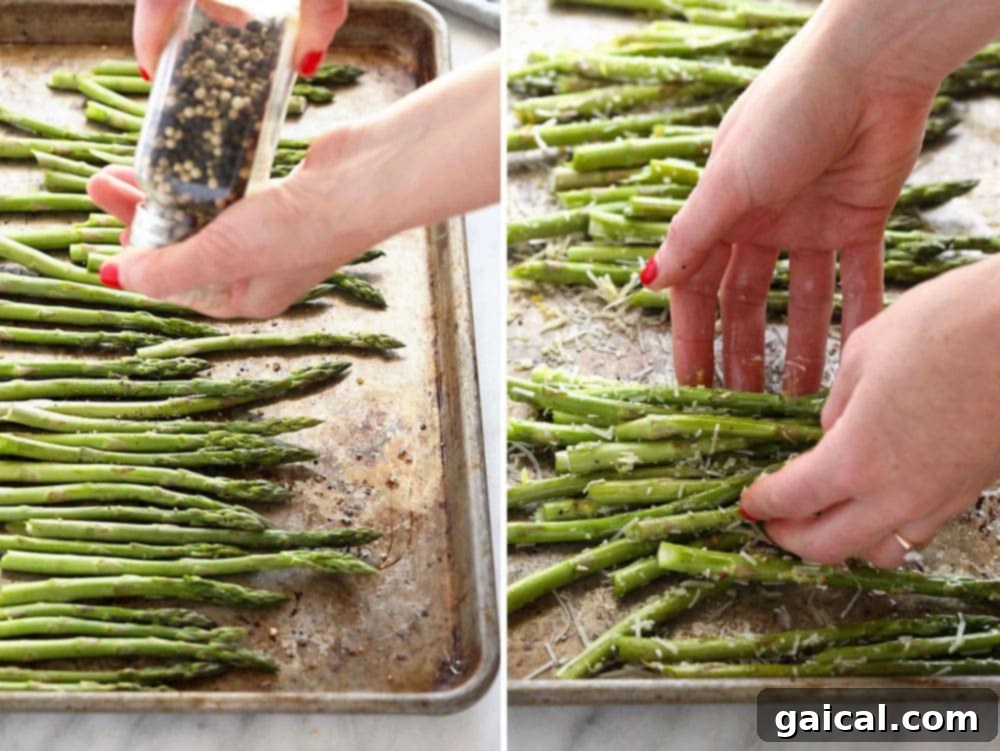 Golden Roasted Asparagus 3 Asparagus spears being seasoned with salt and pepper on a baking sheet.