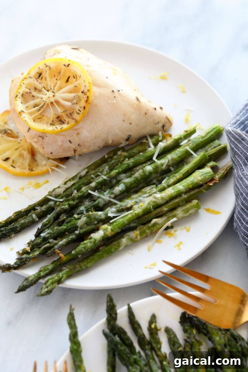Golden Roasted Asparagus 5 Roasted asparagus served alongside a perfectly cooked chicken breast for a balanced meal.