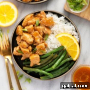 Instant Pot Orange Chicken served with rice and green beans.