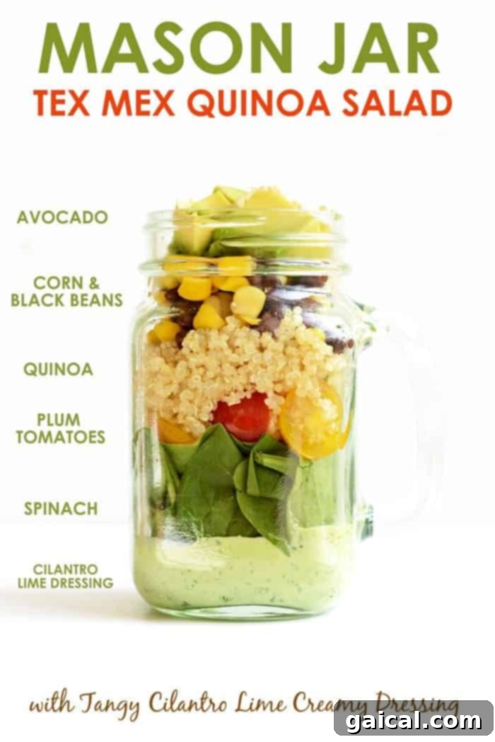 Tex-Mex Quinoa Power Jar 4 Mason jar salad ingredients perfectly layered in a mason jar, showing dressing at the bottom, then quinoa, black beans, corn, tomatoes, and spinach.