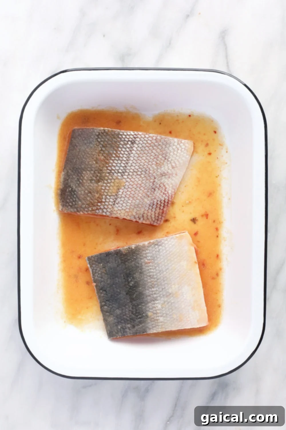 Salmon fillets marinating in a flavorful miso ginger sauce