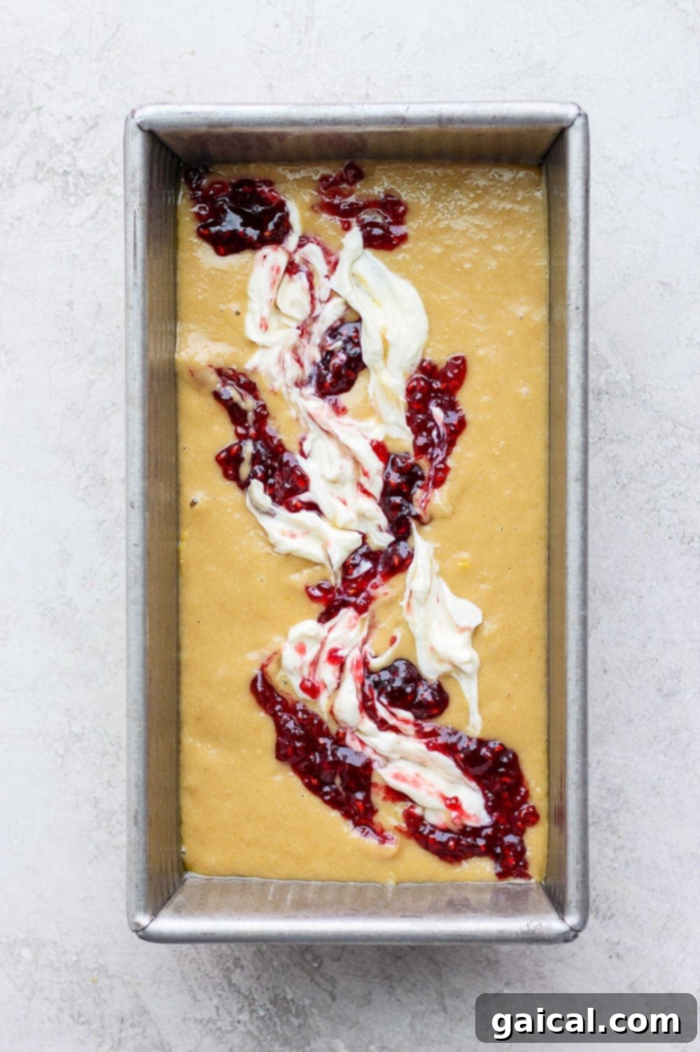 Lemon bread batter in a loaf pan, ready for the oven