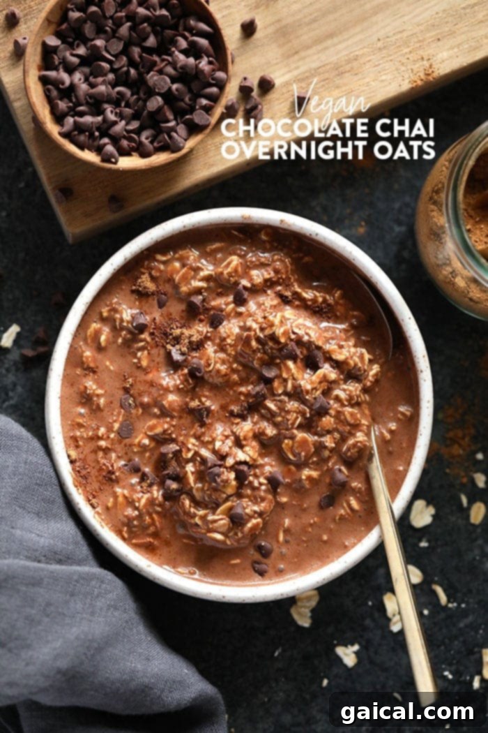 A bowl of creamy chocolate chai vegan overnight oats, topped with a sprinkle of spices, ready to be enjoyed.