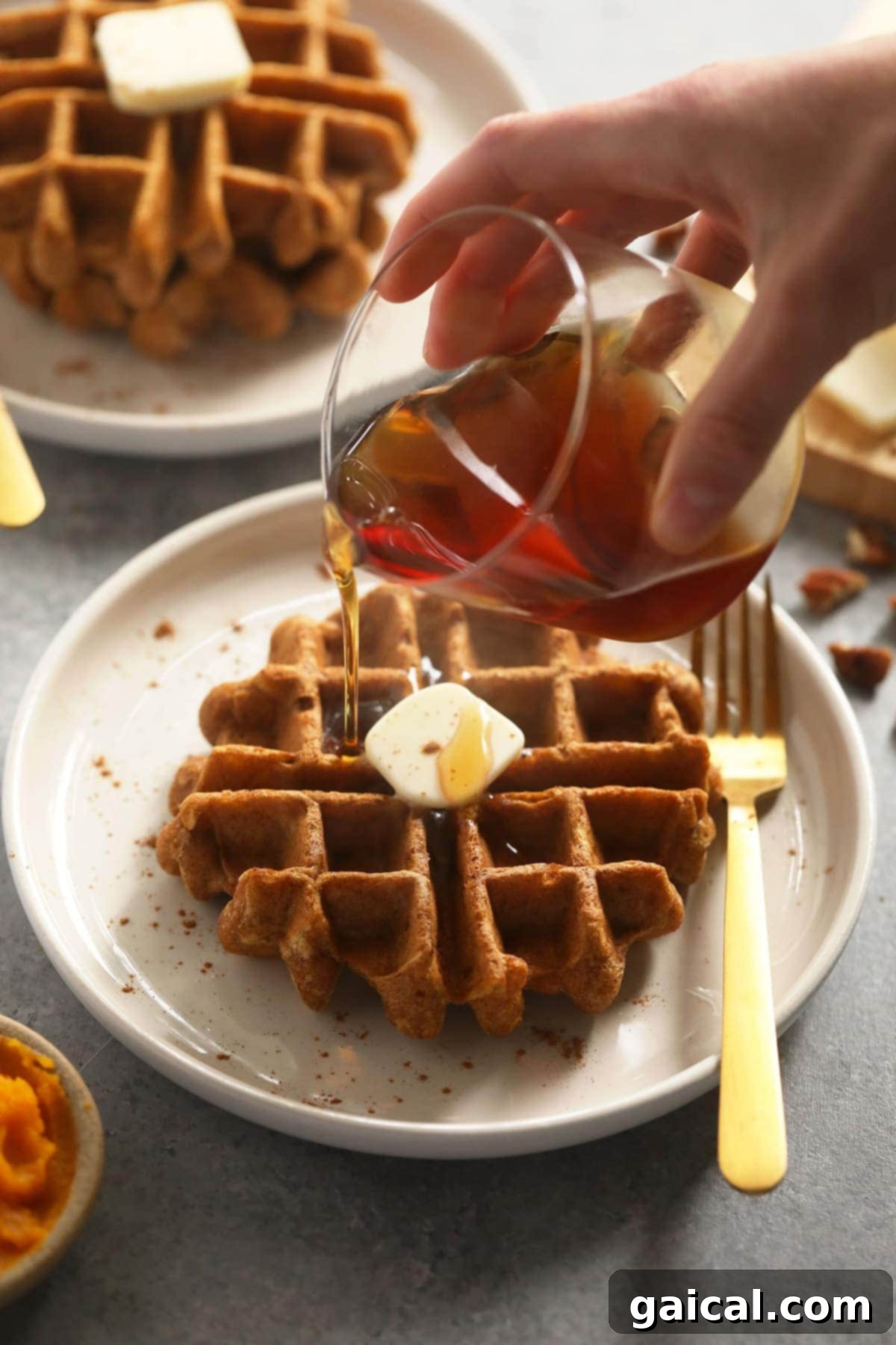 Cozy Gluten-Free Pumpkin Spice Waffles 2 A stack of freshly made gluten-free pumpkin waffles, invitingly golden and fluffy.