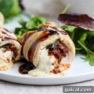 Caprese Chicken Pockets 3 Caprese stuffed chicken breast on a plate, ready to be served from the recipe card.