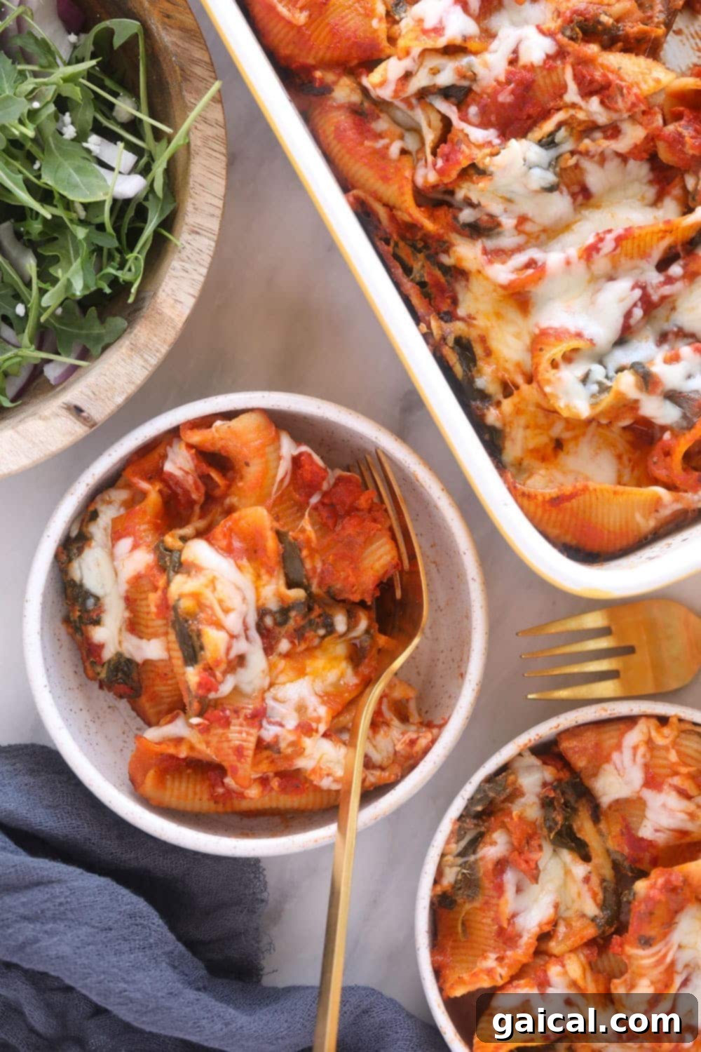 Creamy Sweet Potato, Spinach and Ricotta Stuffed Shells 7 A serving of sweet potato and spinach stuffed shells in a bowl, garnished with fresh herbs.