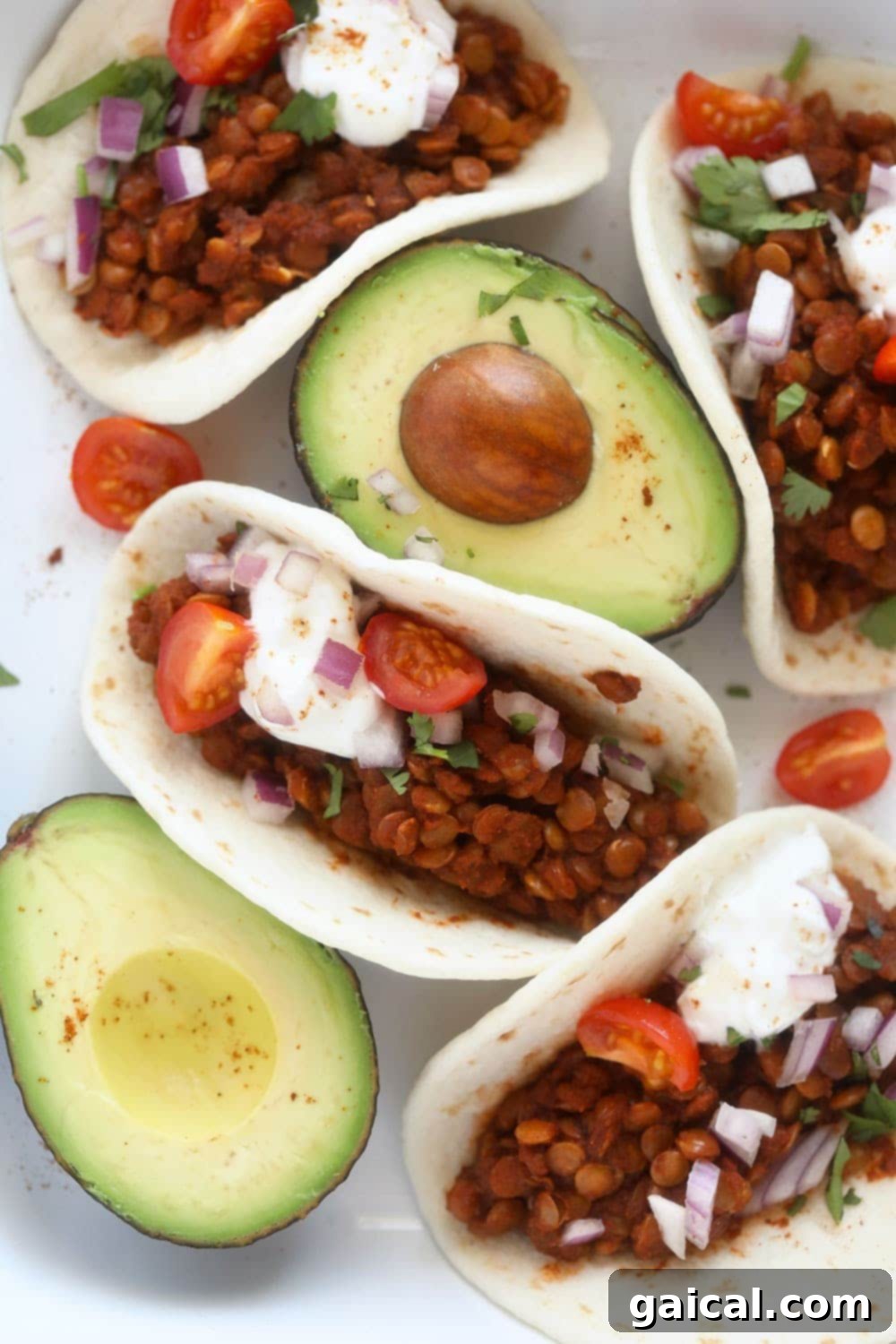 Nutritious and Easy Instant Pot Lentil Tacos A vibrant platter of Instant Pot Lentil Tacos, showcasing a colorful spread of toppings like avocado, salsa, and fresh cilantro, inviting diners to enjoy a healthy and flavorful meal.