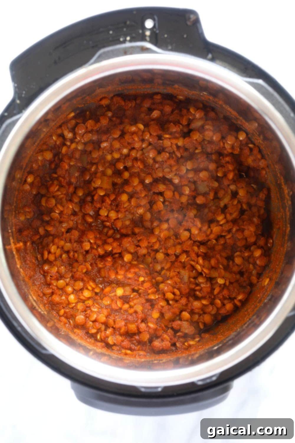 Cooked Lentil Taco Filling in Instant Pot Cooked Instant Pot Lentil Tacos filling inside the Instant Pot, showing its rich, savory texture ready for serving.