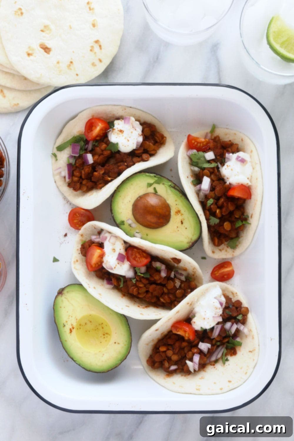 Delicious Instant Pot Lentil Tacos Platter A beautifully arranged platter of Instant Pot Lentil Tacos, garnished with fresh cilantro and lime wedges, ready to be enjoyed.