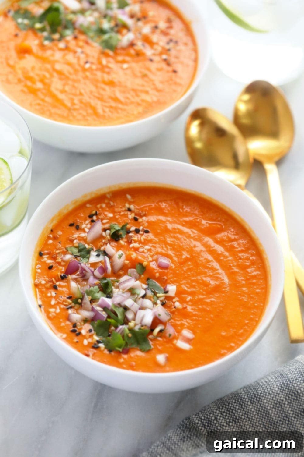 A beautifully presented bowl of Instant Pot Sweet Potato Carrot Ginger Soup, ready to be enjoyed.