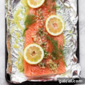 A vibrant bowl of fresh salmon marinade, featuring bright lemon slices, aromatic dill sprigs, and pungent garlic cloves, ready to infuse salmon with flavor.