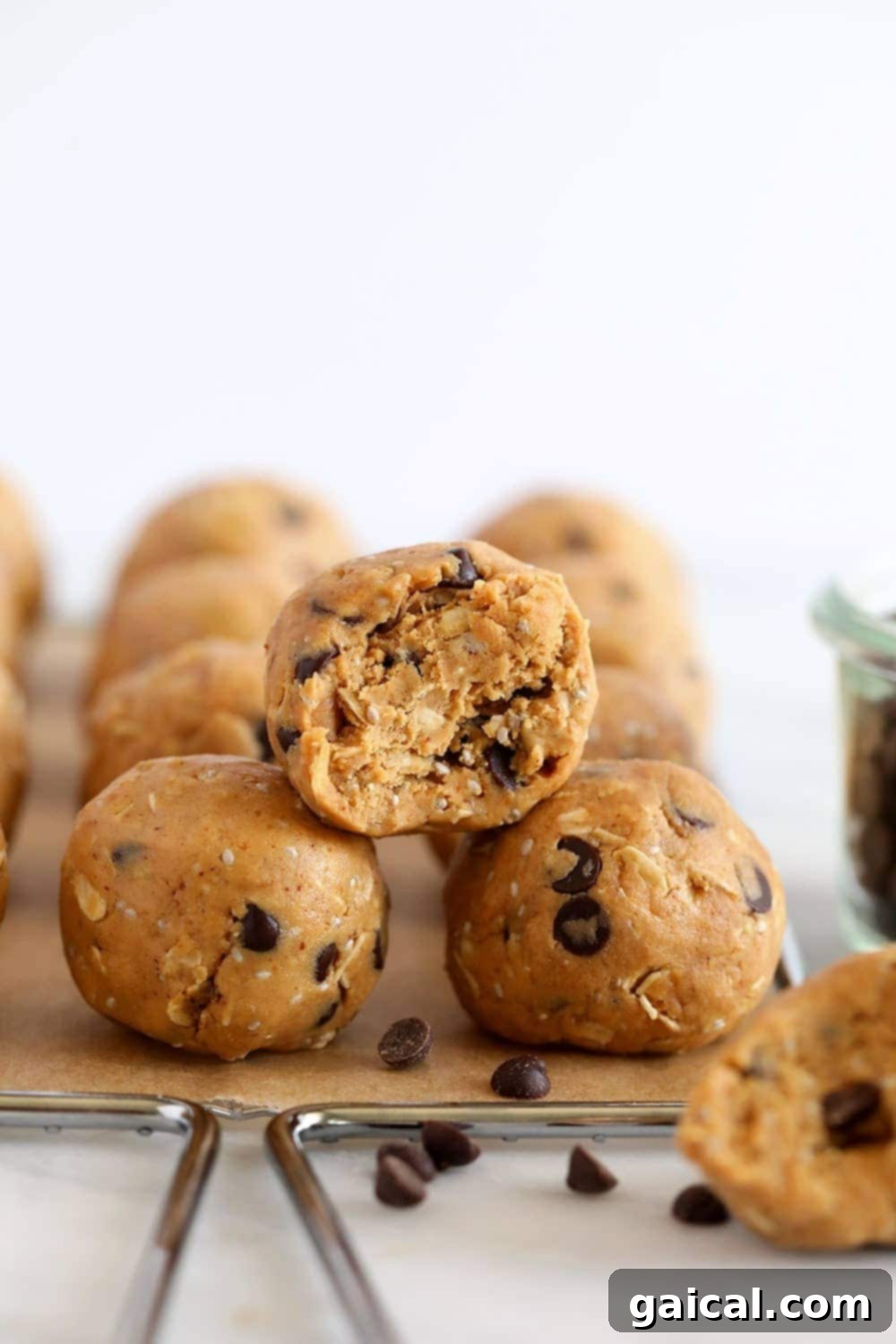 High-Protein Peanut Butter Protein Balls: Quick & Easy No-Bake Snack A stack of golden brown peanut butter protein balls with mini chocolate chips