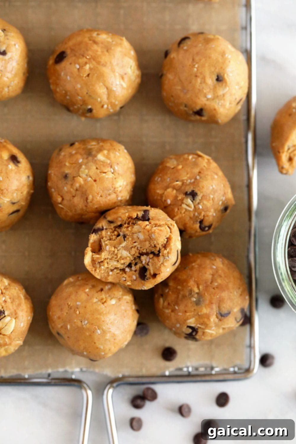 Perfectly Rolled Peanut Butter Protein Balls on a Tray Finished peanut butter protein balls resting on a tray.