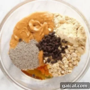 A bowl of mixed ingredients for peanut butter protein balls.