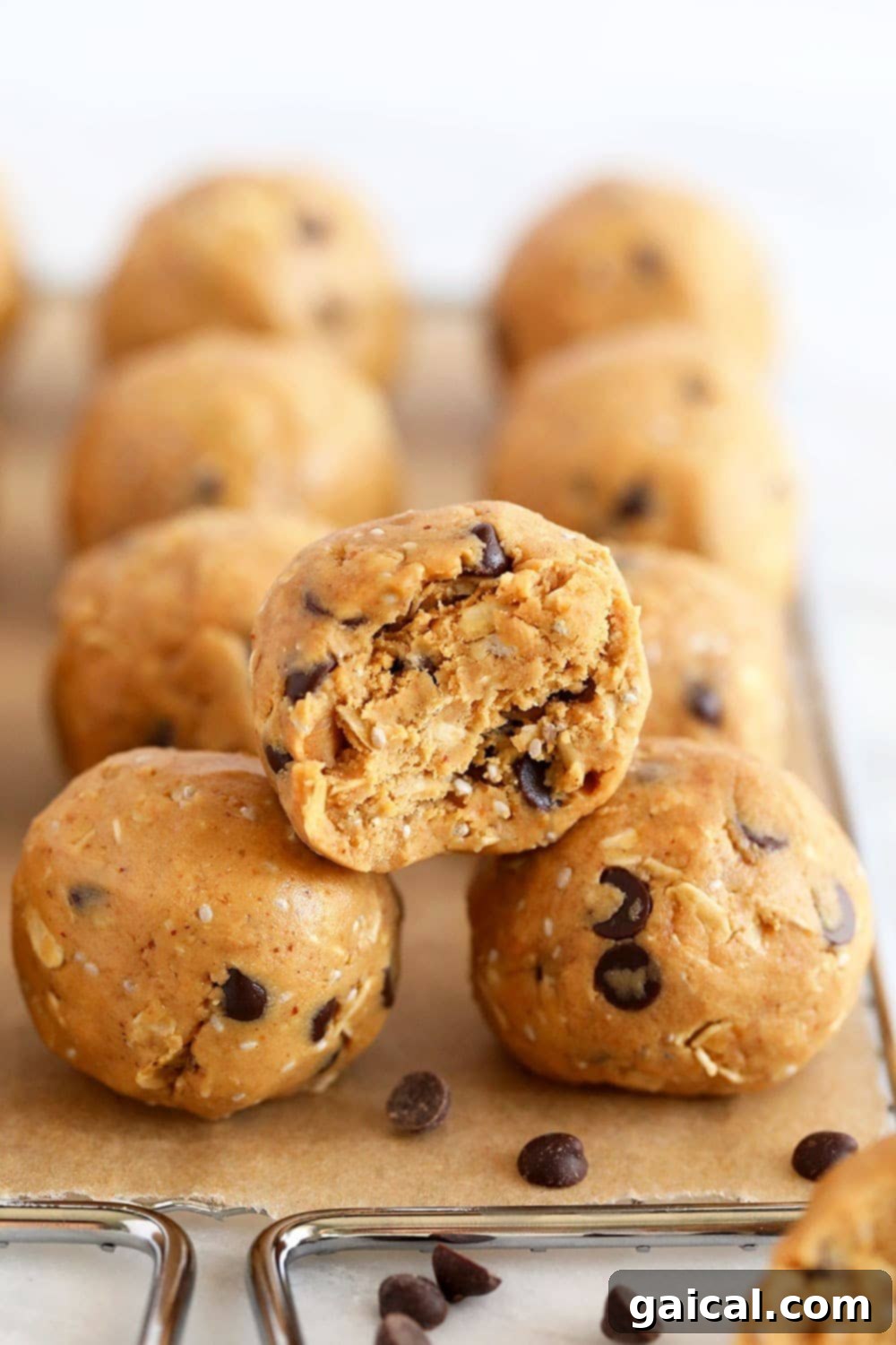 The BEST Peanut Butter Protein Balls Recipe Multiple peanut butter protein balls neatly stacked, showcasing their perfect shape and texture.