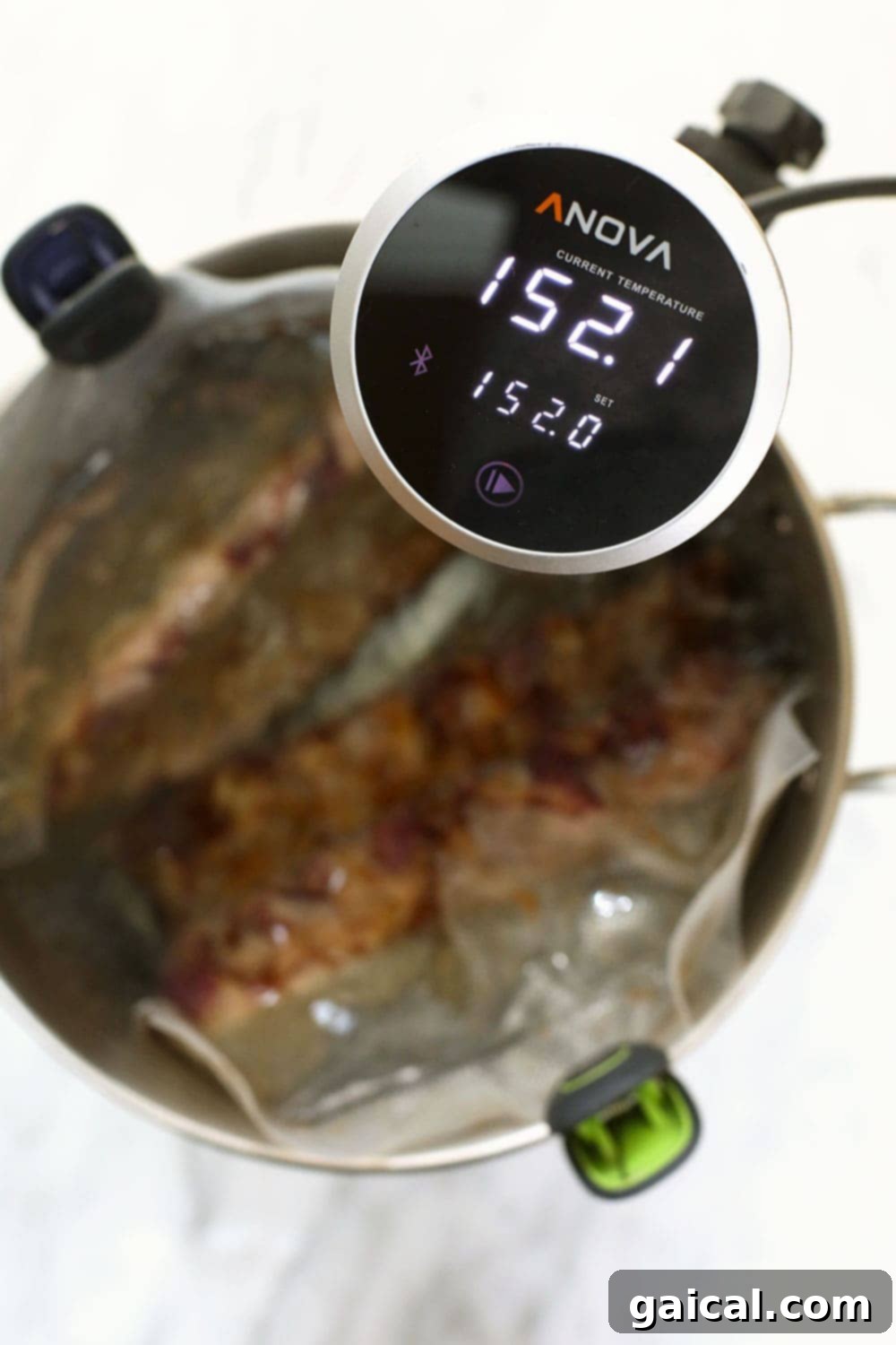 Sous vide your ribs for 24 hours in a 152ºF water bath for the best tasting ribs on the internet! These sous vide pork ribs are fall-off-the-bone tender and so delicious! Ribs in a sous vide at 152.1ºF.