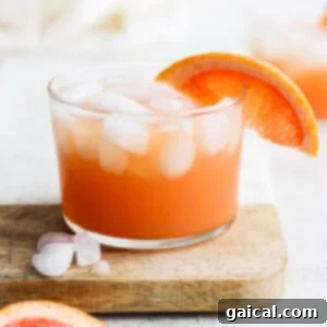 A refreshing Paloma cocktail, garnished and ready to be enjoyed.