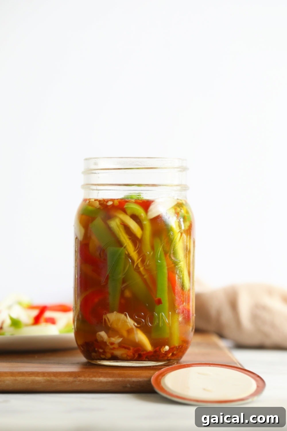 Quick pickled peppers in a mason jar, showcasing vibrant colors and fresh ingredients