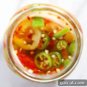 A jar with quick pickled spicy peppers.