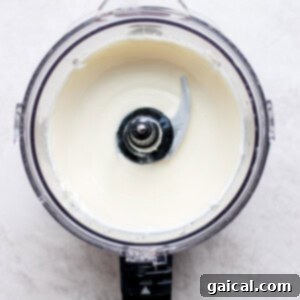 Creamy cheesecake filling in a food processor, before adding blueberries.