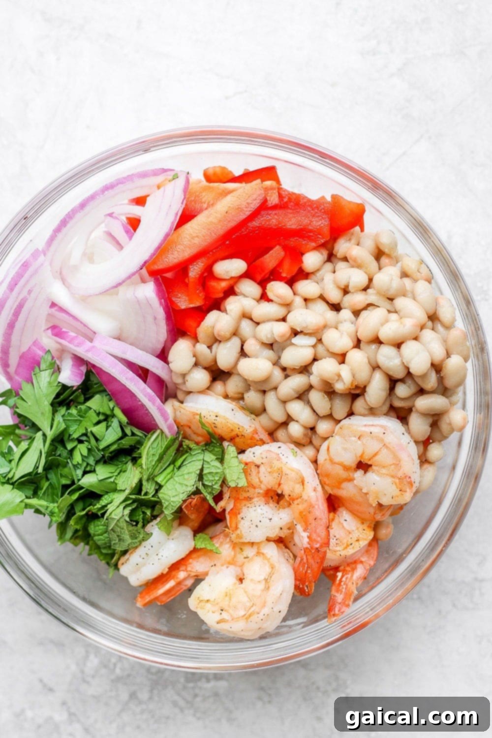 Vibrant Shrimp Salad 5 all ingredients for a healthy shrimp salad in a bowl before they're mixed together