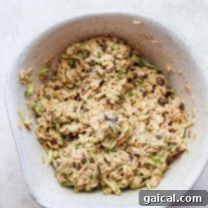 A bowl full of oats in a white bowl.