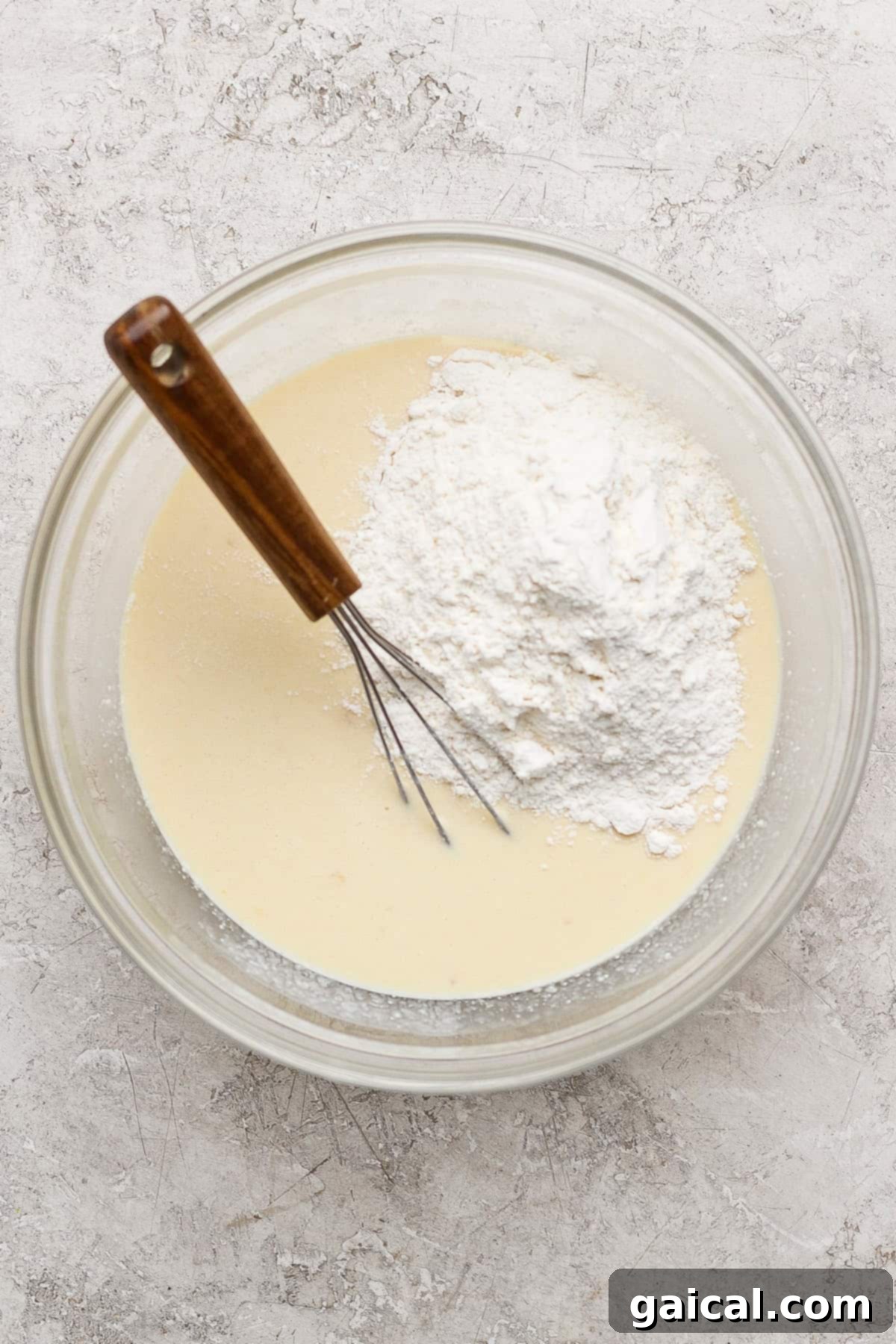 Mixing batter in a glass bowl