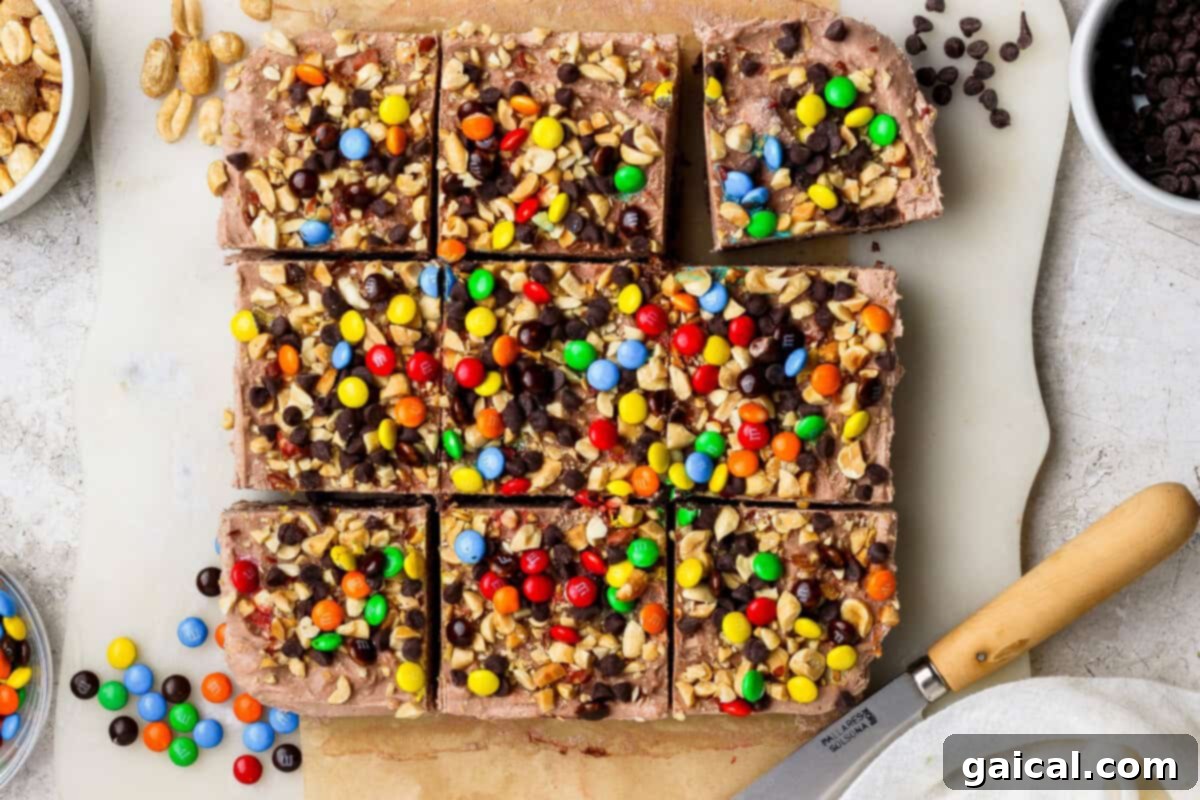 No-Bake Cottage Cheese Dream Bars 2 Delicious cottage cheese cheesecake bars topped with peanuts, chocolate chips, and candy-coated chocolates.