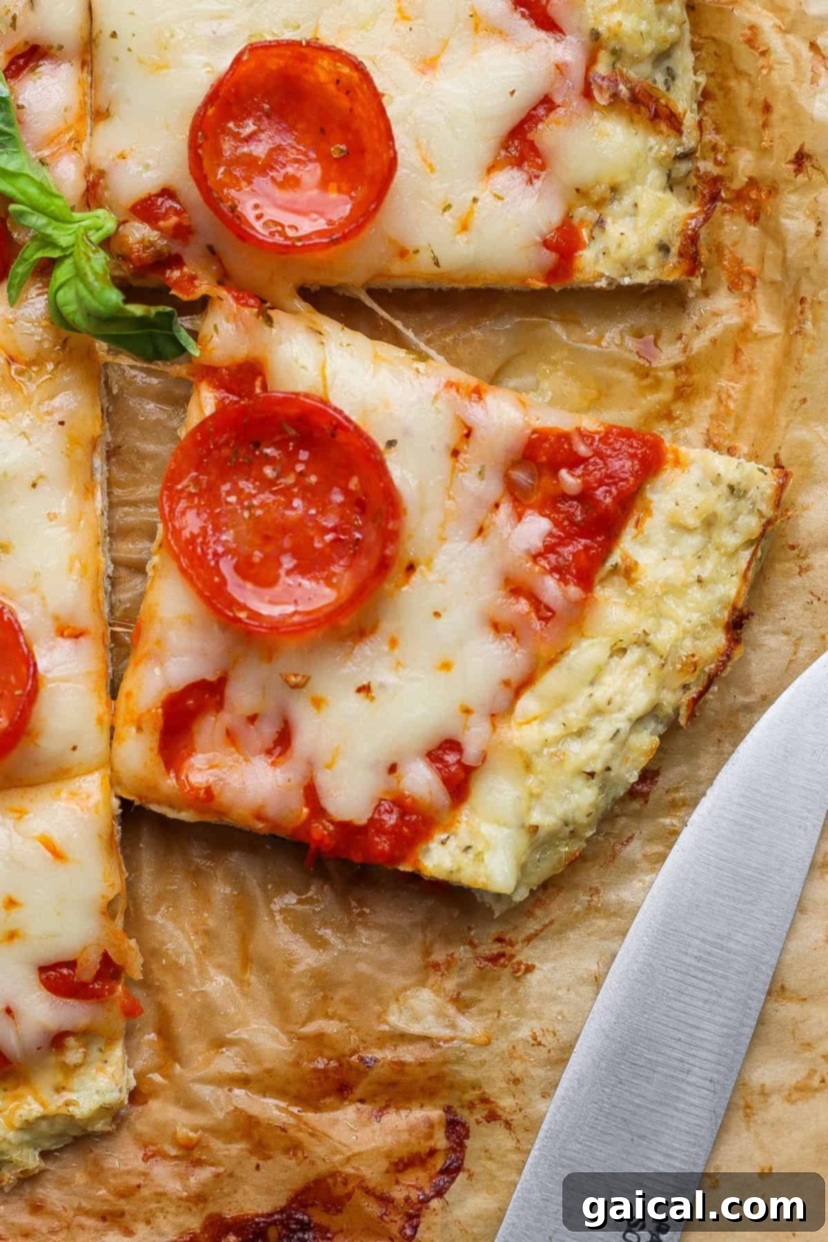 Close-up of a slice of chicken crust pizza.