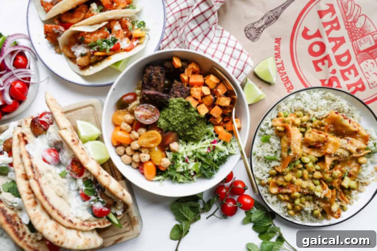 Assorted dishes with tacos, naan wraps, rice with vegetables, a grain bowl with sweet potatoes and greens, and a Trader Joe's paper bag on a white surface.