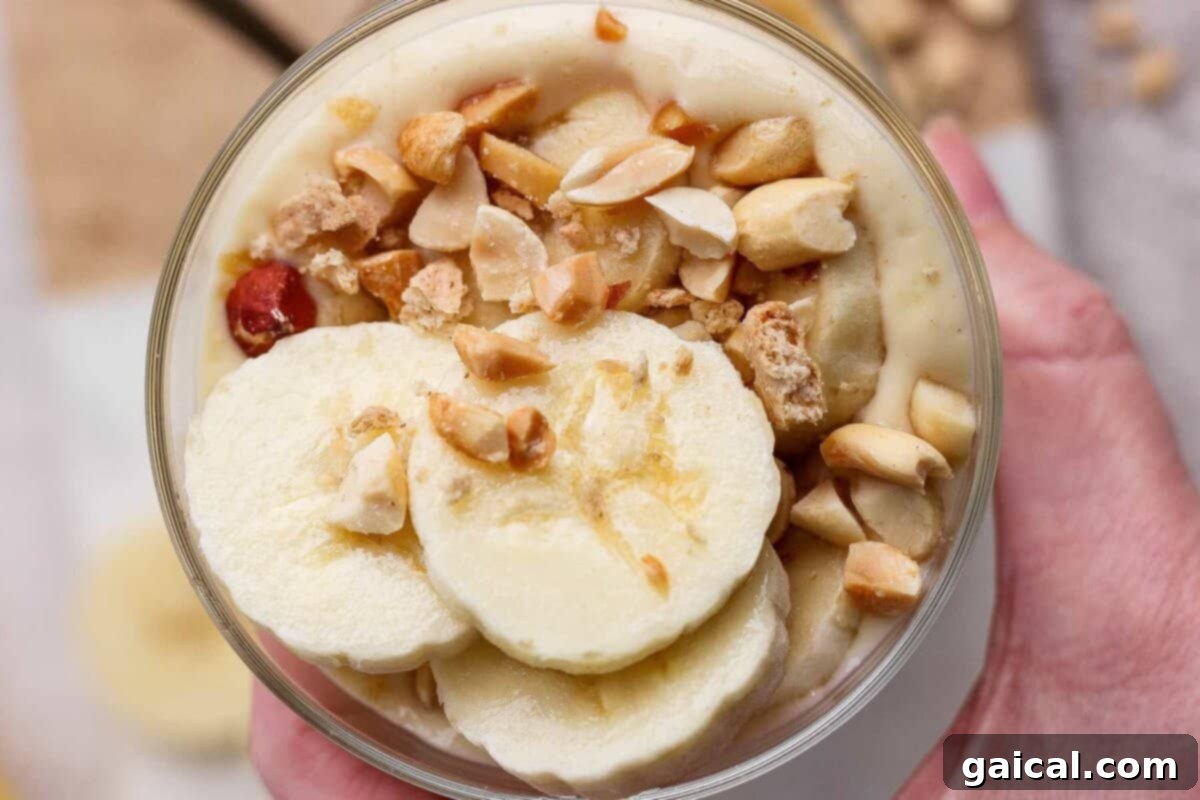High-Protein Banana Dream 2 Creamy high-protein banana pudding topped with banana slices and peanuts
