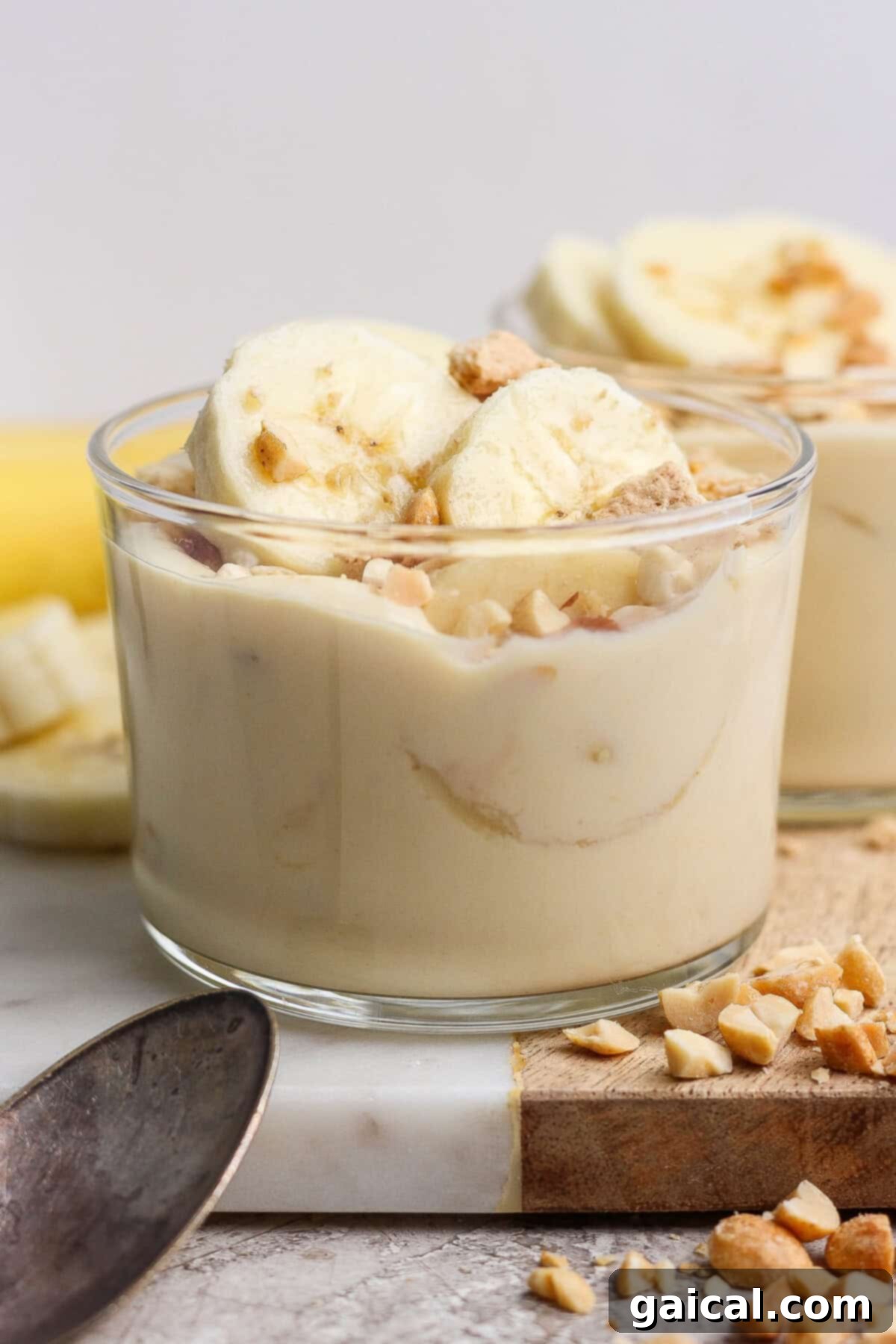 High-Protein Banana Dream 7 Close-up of banana pudding topped with bananas and nuts