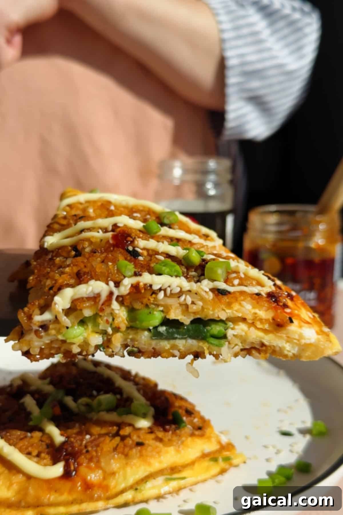 Close-up of a crispy rice omelette slice